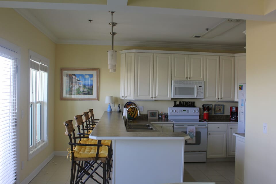 Full kitchen with bar seating for 4, and an island view while you cook.