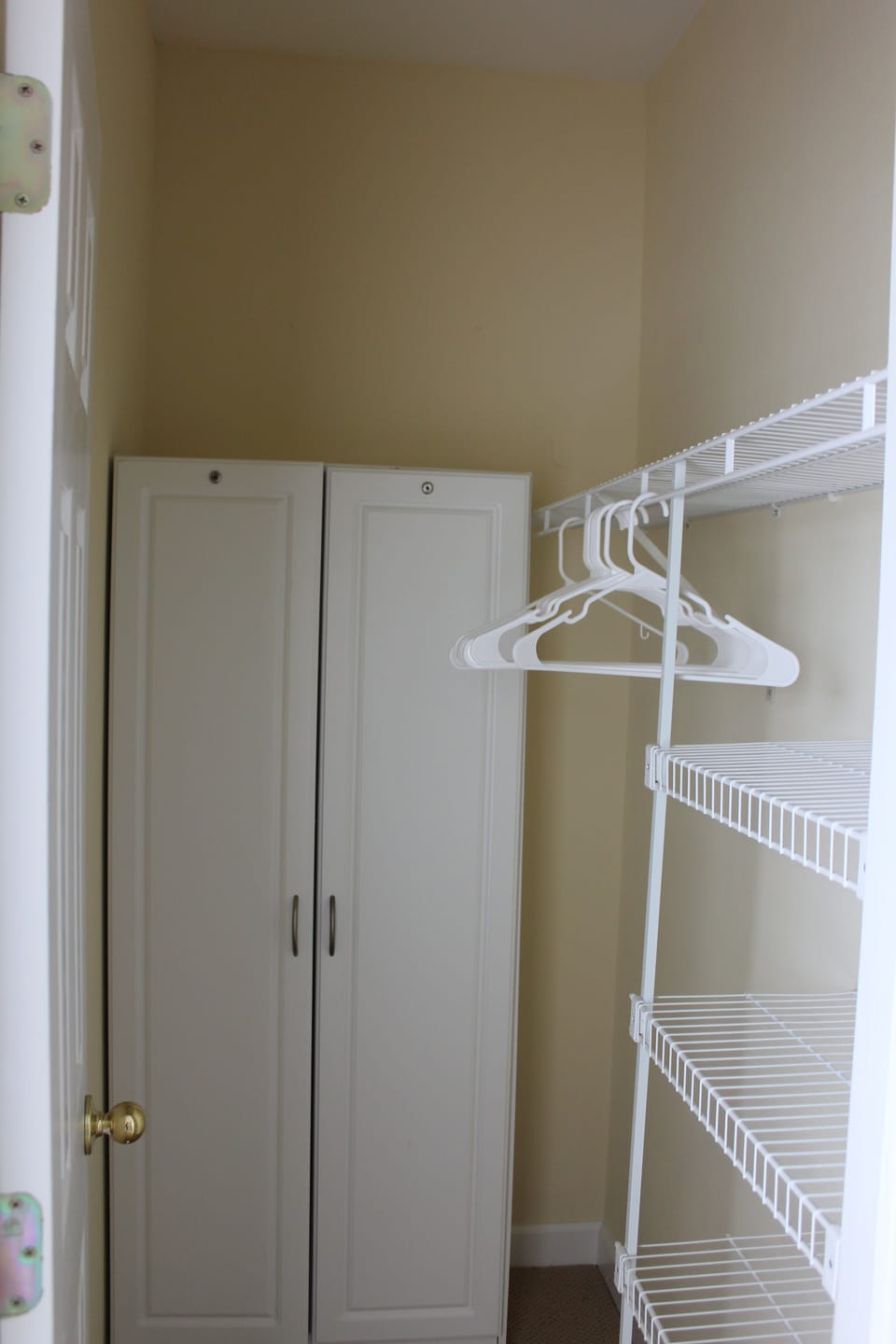 Walk in closet with shelf storage.