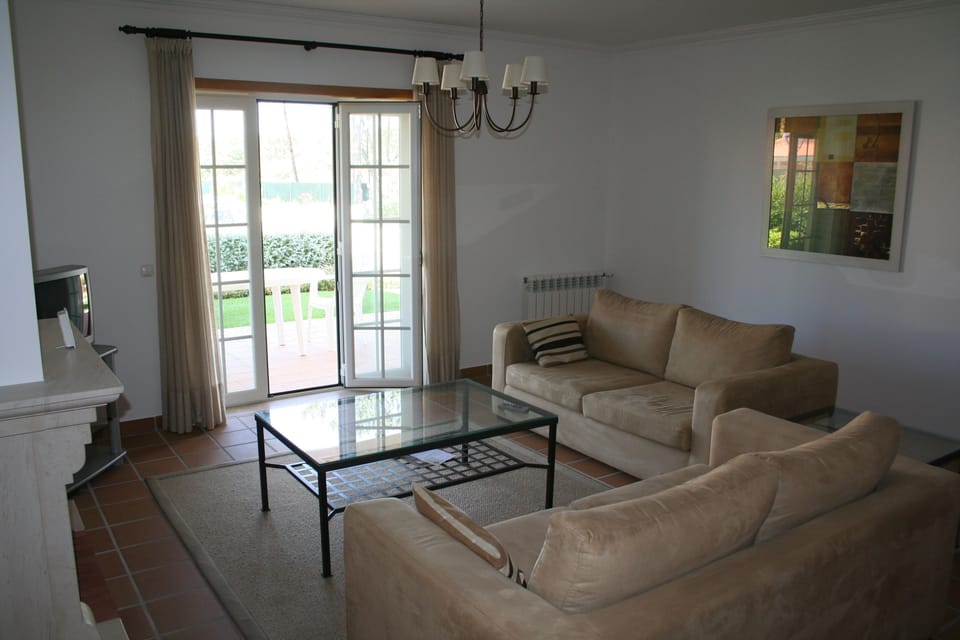Spacious living room with direct garden access