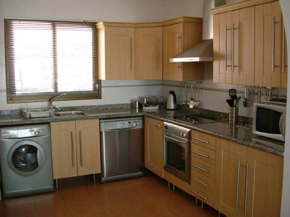 Large exceptionally well  equipped modern kitchen has all mod cons.