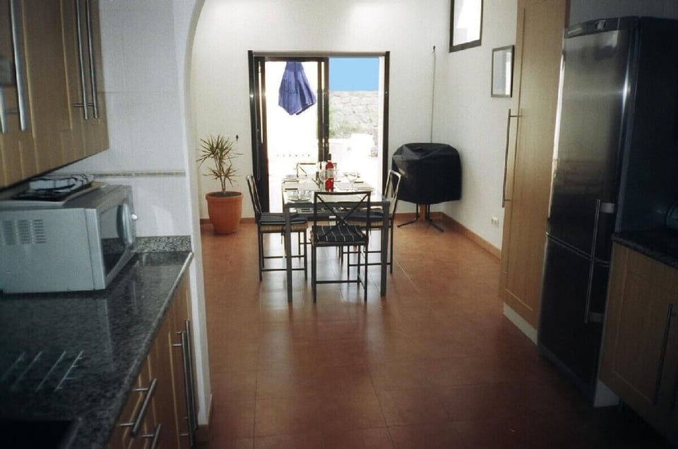 Spacious self contained open plan kitchen dining area patio doors to BBQ terrace