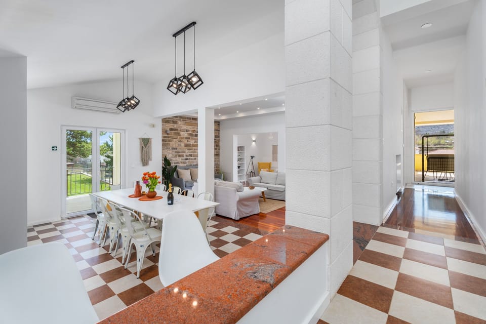 dining & living area and exit to pool area 
