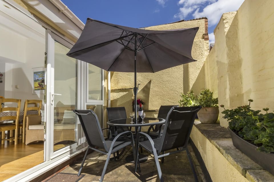 Dine al fresco in the sunny courtyard garden