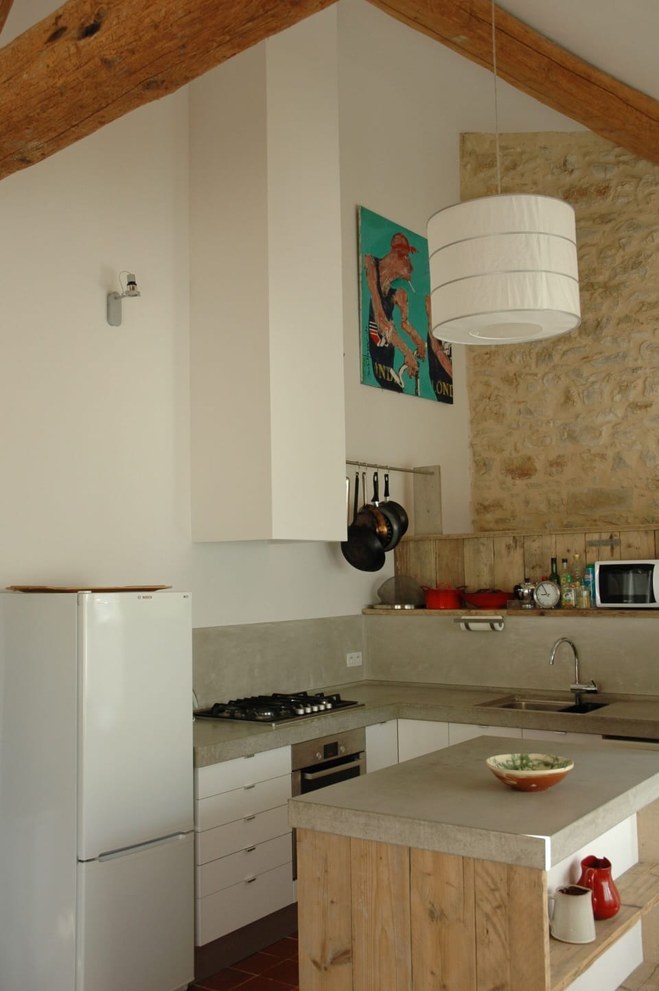 Wood burner and dining room with french windows 
opening to the terrace