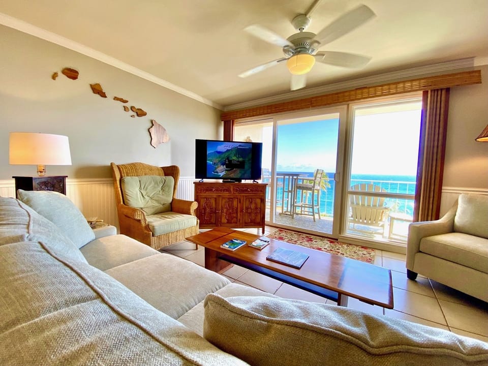 Relax in the living room with a view of the ocean.