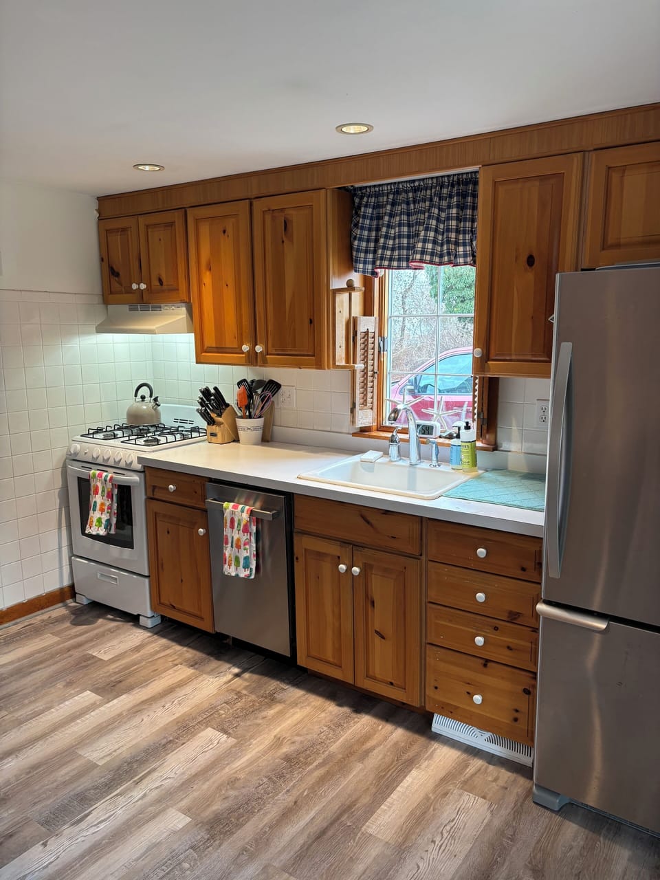 Kitchen, with dishwasher, oven, and new flooring