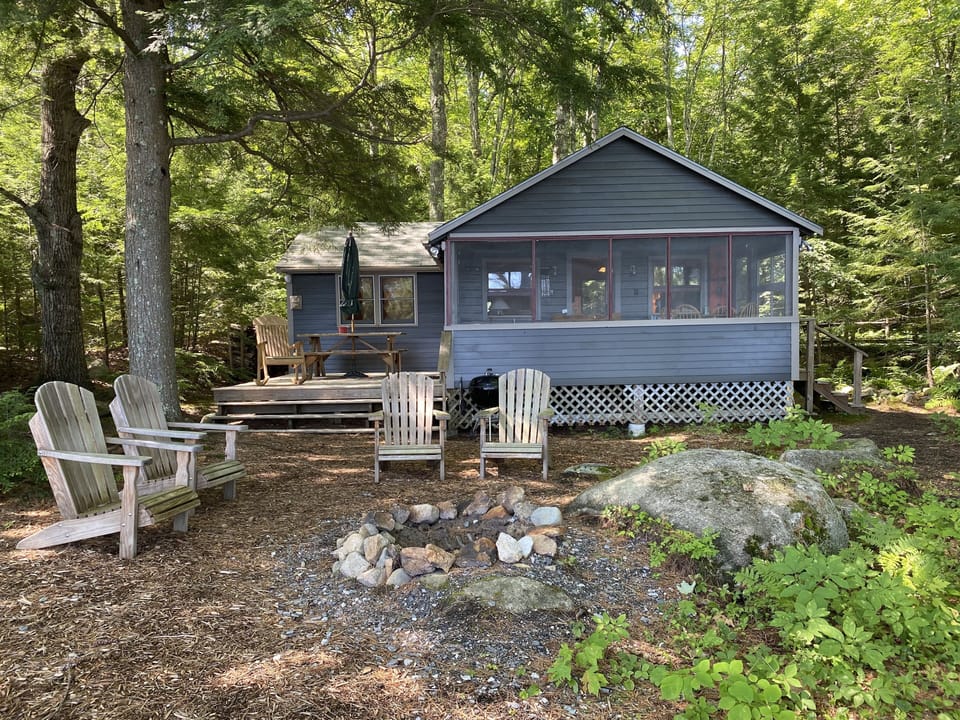 Lakeside of Cabin with deck on the left and screened porch on the right
