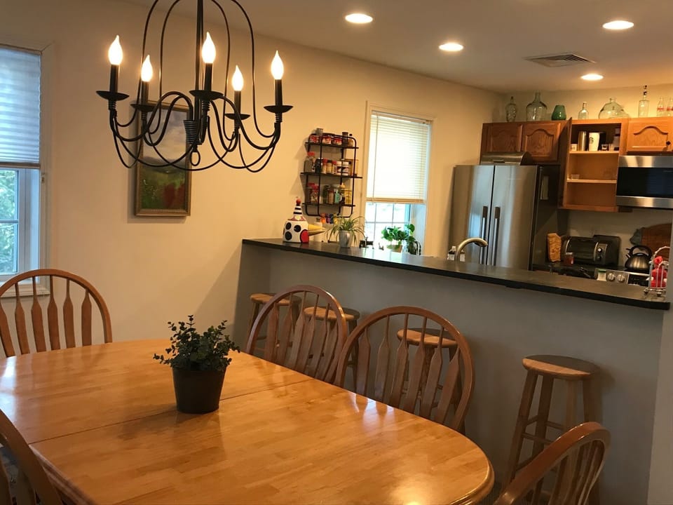 The dining room table easily seats 8. 4 seats at the counter.