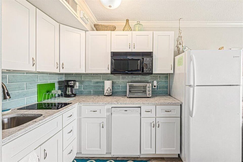 Drip coffee maker, stocked kitchen for light cooking