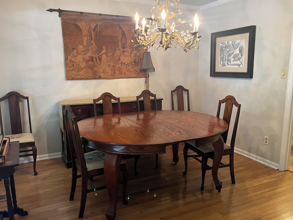 Dining room with a table that expands and plenty of extra chairs
