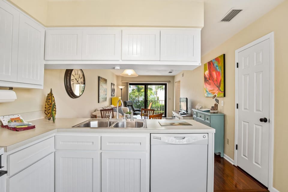 Well-equipped kitchen with Keurig coffee maker, toaster oven & ample cookware.