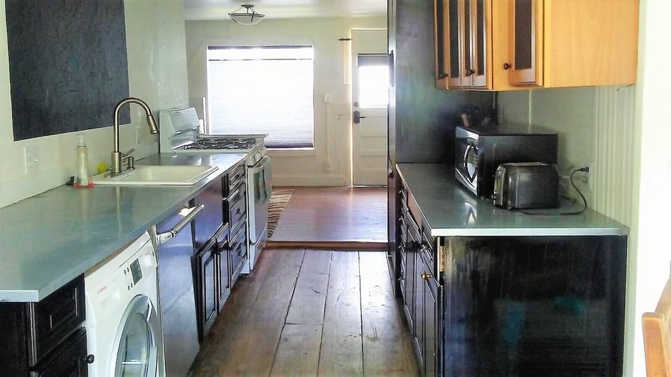 Kitchen equipped with bosch dishwasher, thermador fridge, stove and microwave