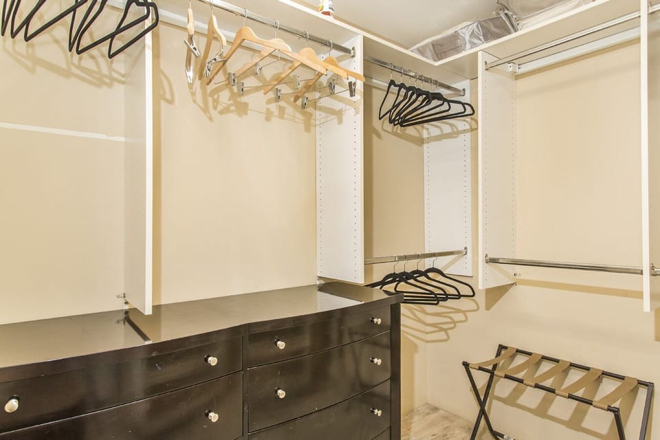 Primary bedroom walk-in closet.