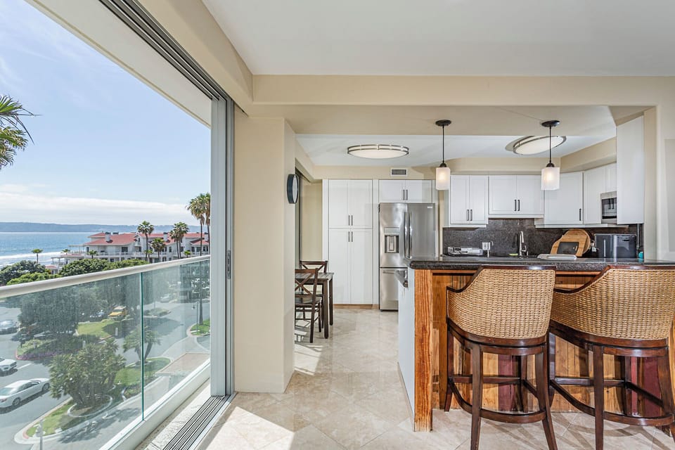 Watch sunsets from the bar. Step out of the unit at any one of the glass sliders