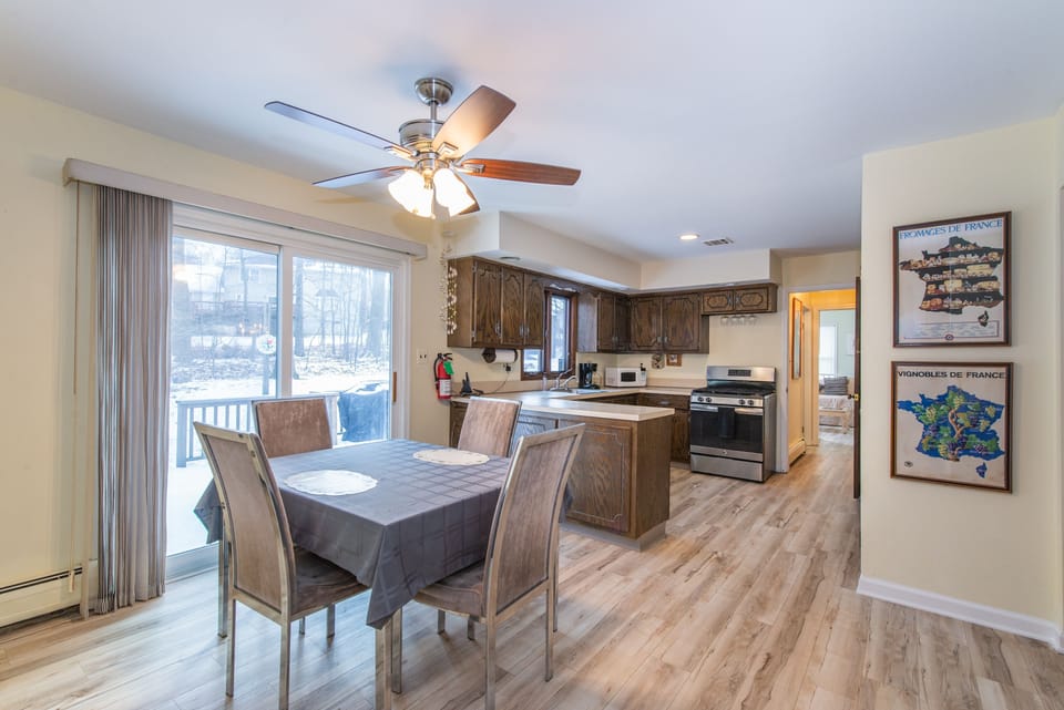 Kitchen dinette opens to deck & back yard.  New flooring in 2021.