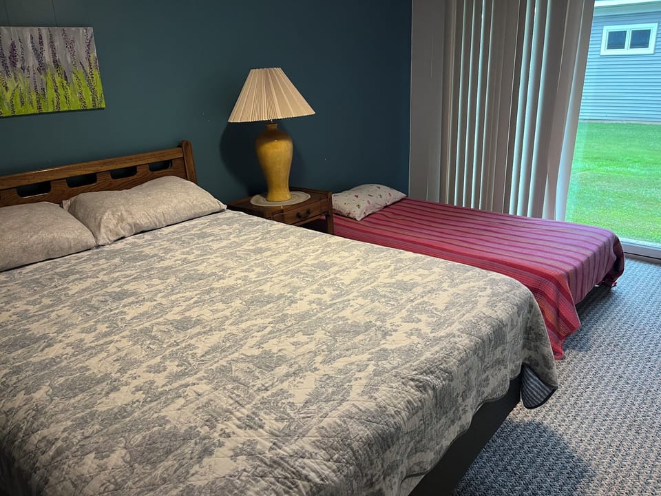 1st guest room on first floor- 1 queen bed and a twin bed