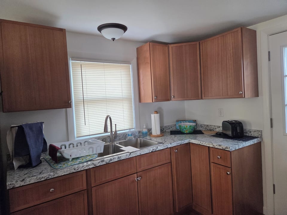 New in 2026, solid wood cabinets throughout kitchen.