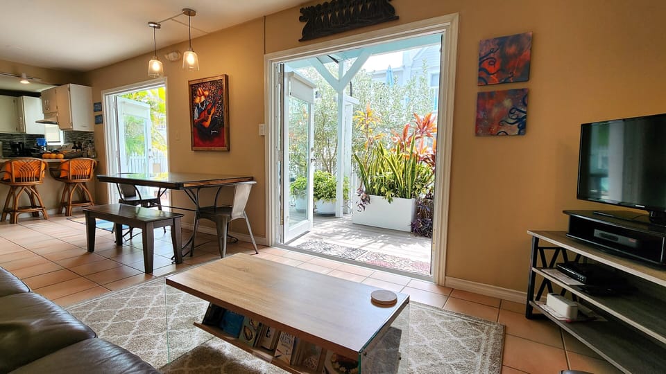 Comfortable and roomy living area with view of private backyard
