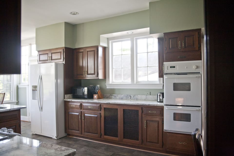 Features 3 ovens, stove, large Refrigerator/Freezer Combo and dishwasher