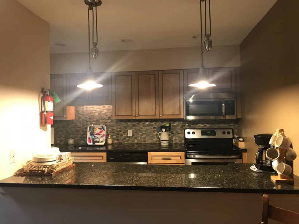 kitchen with 2 bar stools