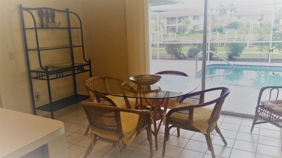 the dinette area, with sliding doors to the pool/lanai