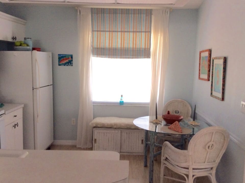 Kitchen provides plenty of meal prep space and intimate seating for 2-3. 
