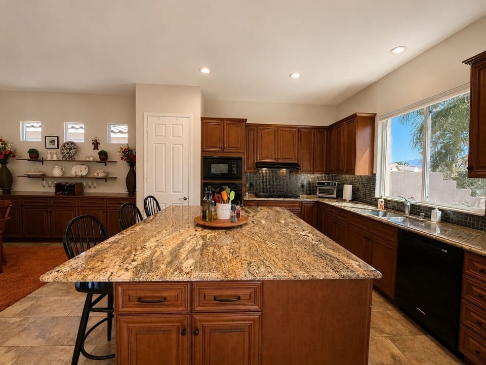 Modern, fully stocked kitchen with quality appliances, cookware and spices