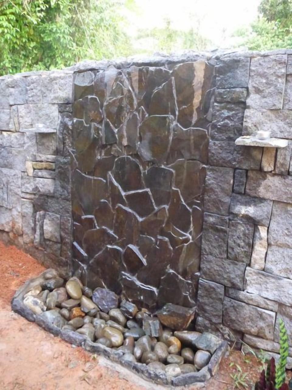 Natural stone garden waterfall/fountain.
