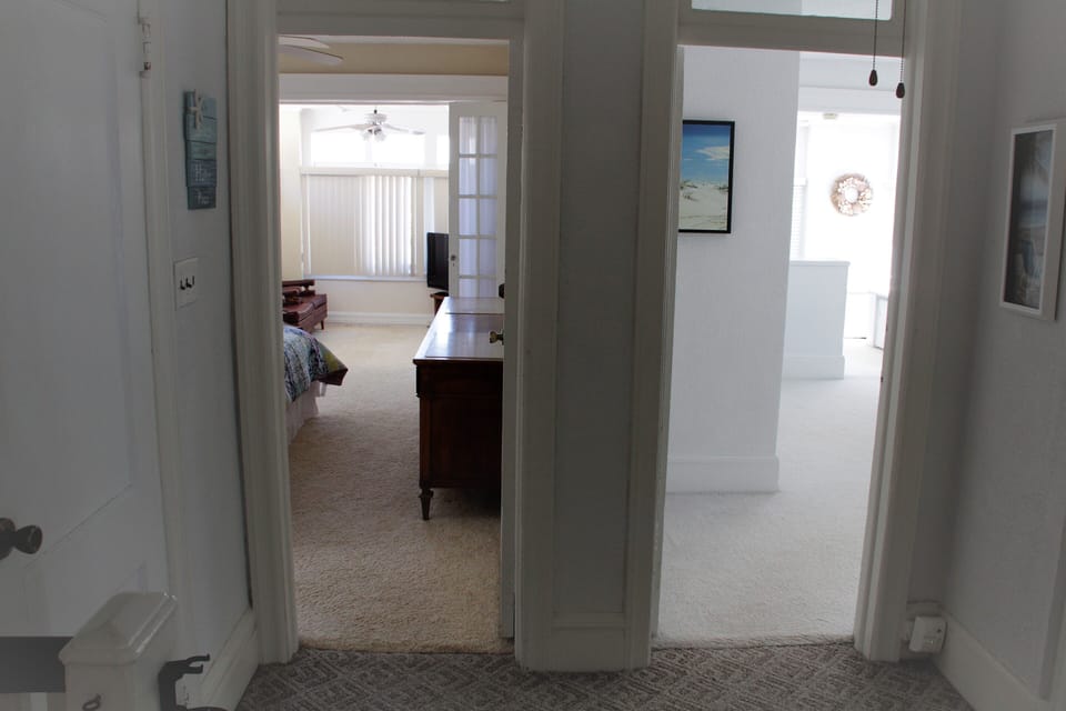 2 master suites each with large sitting rooms to enjoy the breeze and views!!