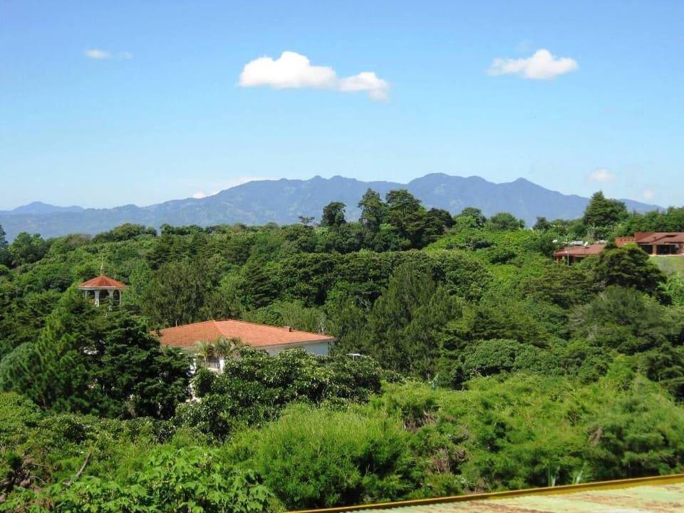 kitchen view of mountains to southeast behind Escazu and two neighbor houses