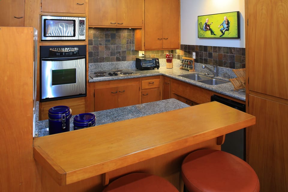 Remodeled kitchen with granite countertops and SS appliances.  