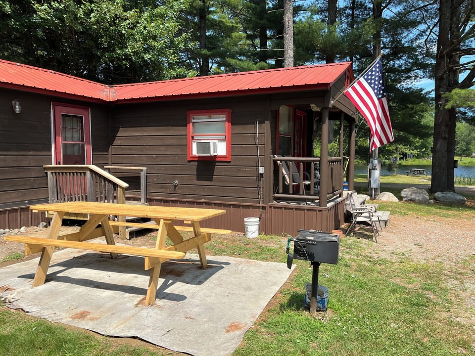 Deer Haven cabin with water view, porch, picnic table & grill