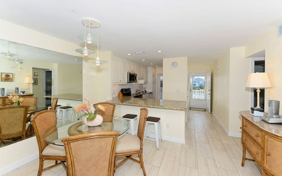 Open the kitchen and main door and see water throughout the condo.
