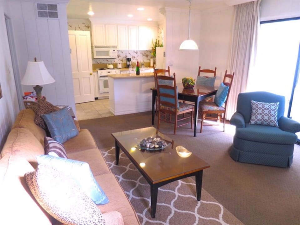 Living room, dining and kitchen with enclosed, private patio