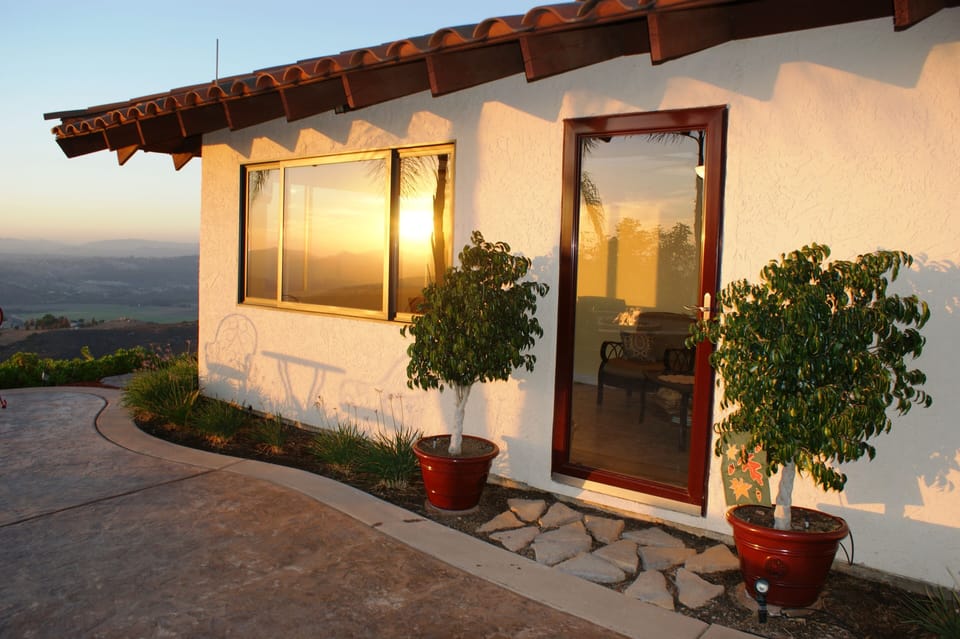 Enjoy the sunroom for the views without the weather.  TV for sports or music.