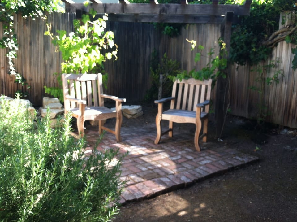 A favorite place to sip wine under the vines in the backyard.