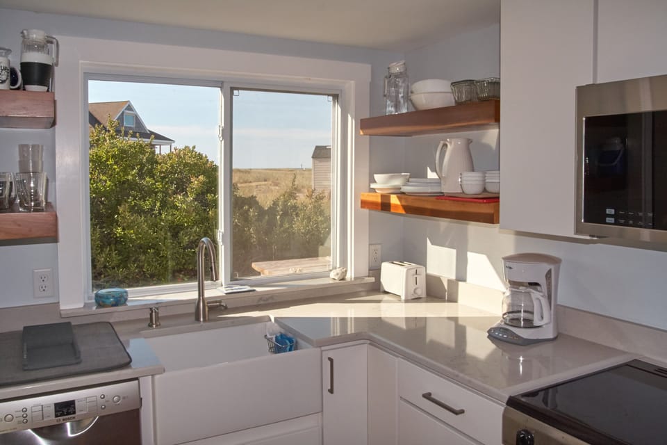 Sunny updated kitchen with view to dunes