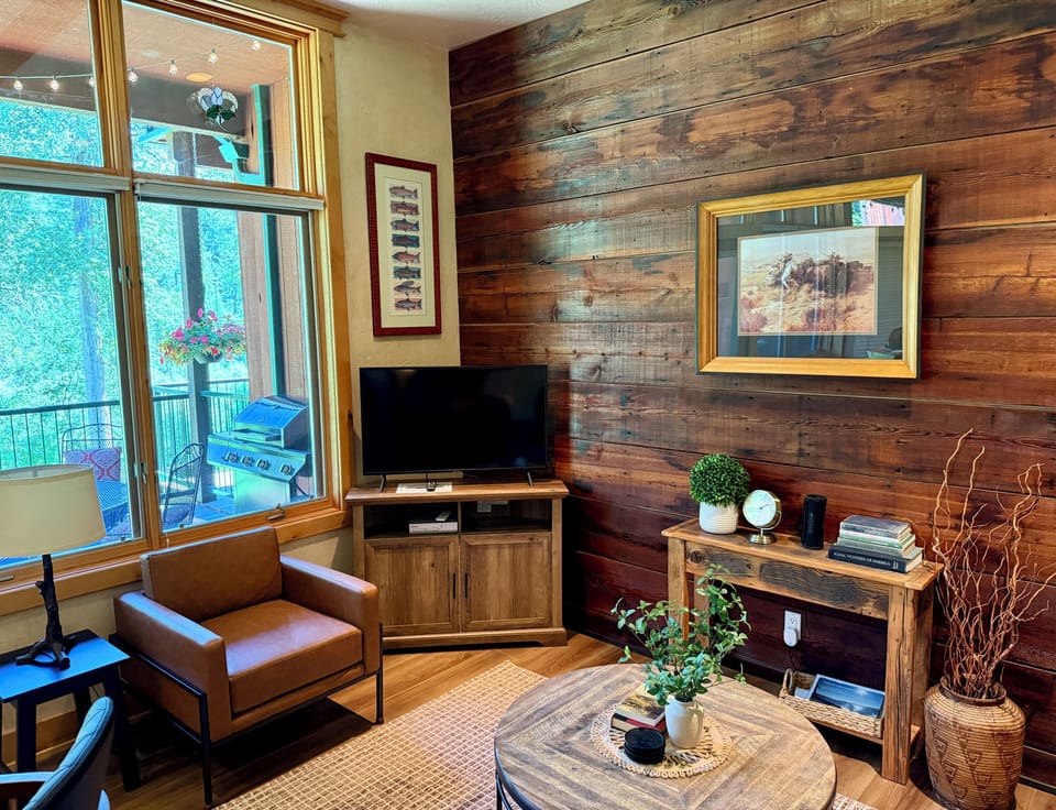 LIVING ROOM WITH WINDOWS TO SWAN RIVER