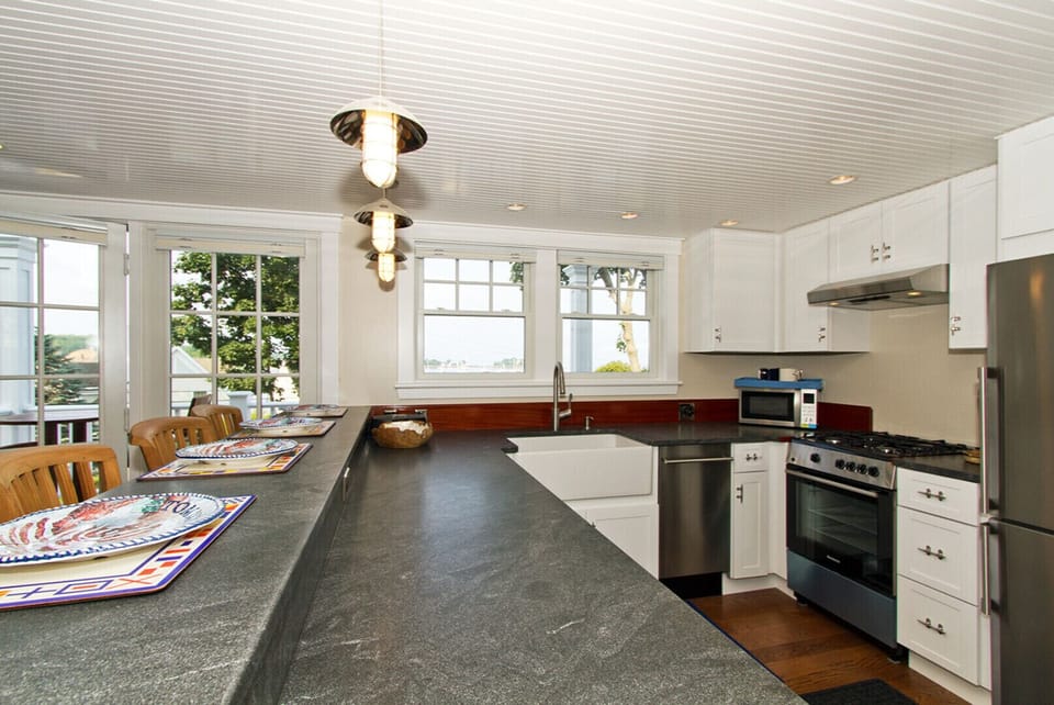 Handsome stone counters and bar tier for drinking and dining.