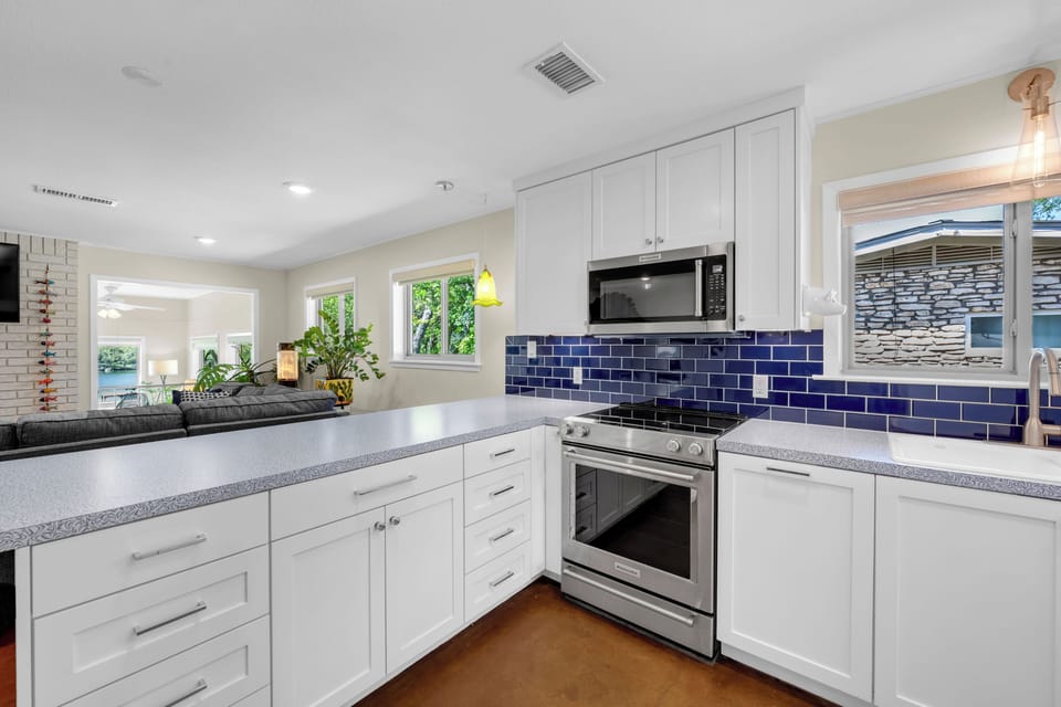Newly remodeled kitchen is only steps from dining areas, both indoors & outside