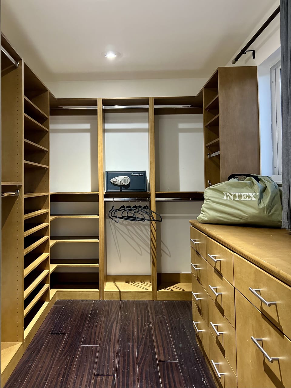 Unpack and prepare for an extended vacation with this luxurious walk in closet. 