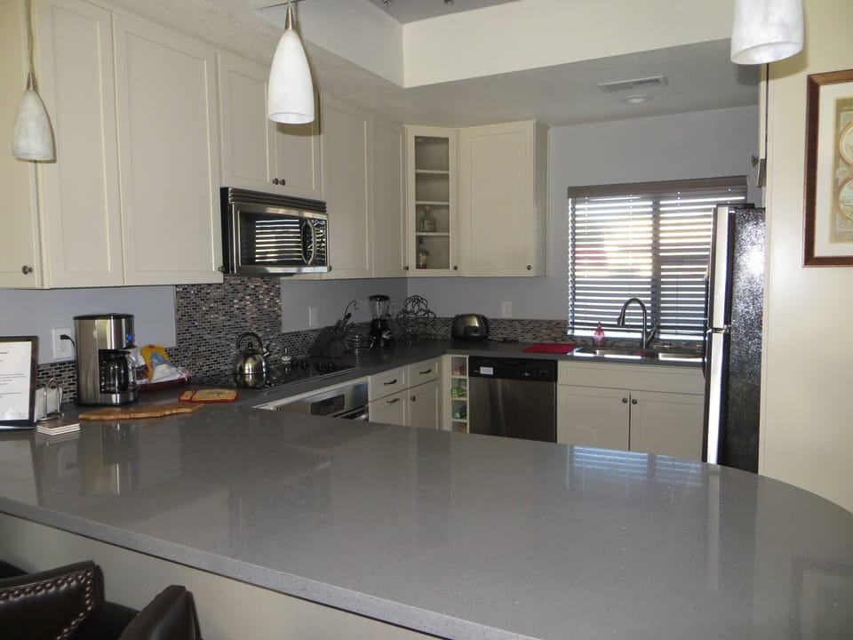 kitchen has a bar and open floor plan