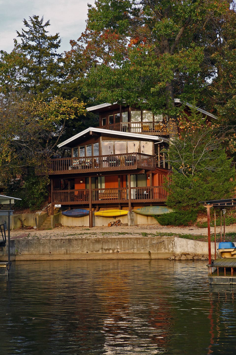 Top two levels are wall-to-wall floor-to-ceiling windows to beautiful lake views