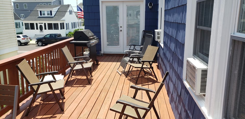 Large side deck has room for grilling and outdoor living.
