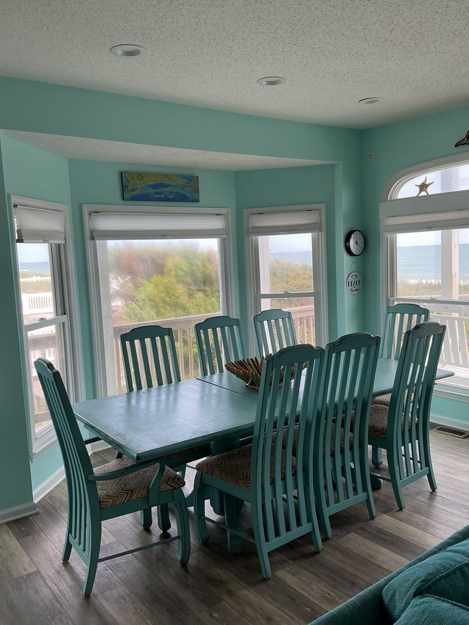 Dining room table has two extra chairs to seat 10 total.