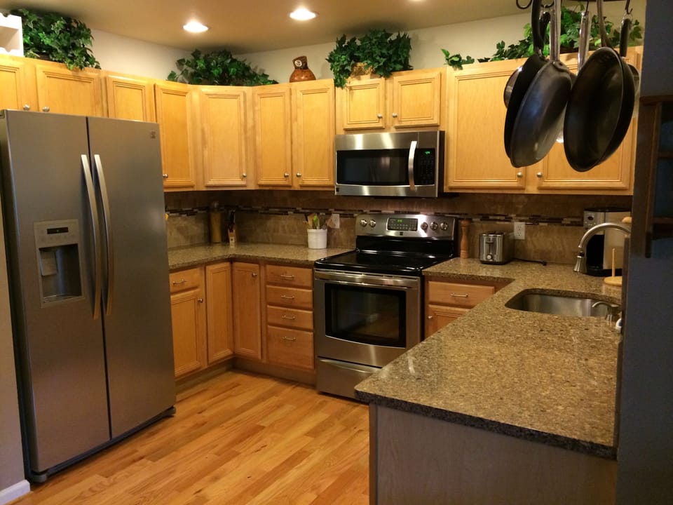 Newly updated open kitchen with stainless appliances, new counters & backsplash.