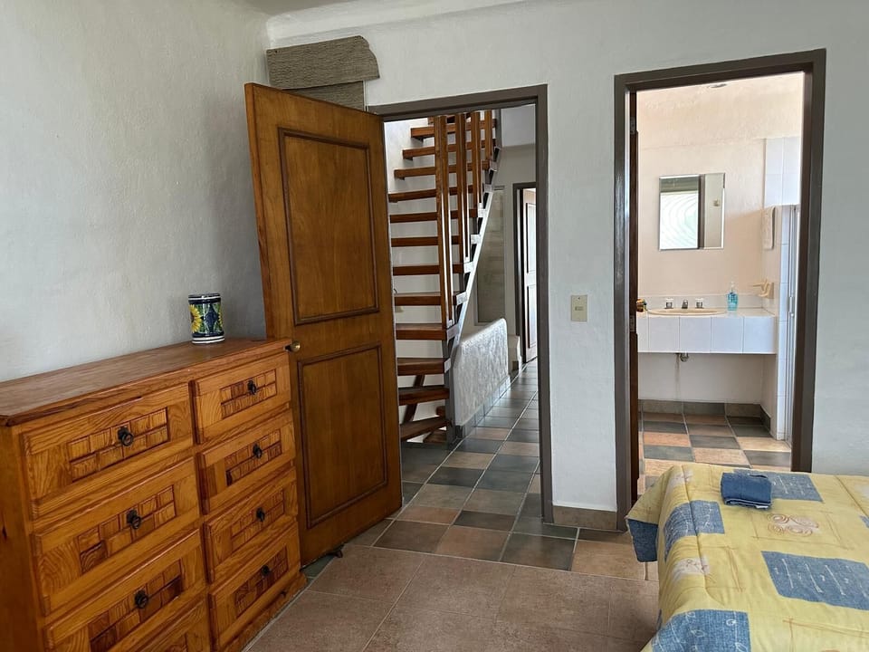 Twin Bedroom looking towards the en suite bathroom and 2nd floor hallway 
