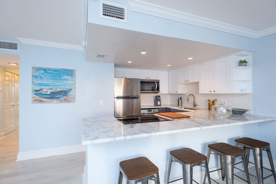 Large Open concept with 4 bar stools on breakfast bar