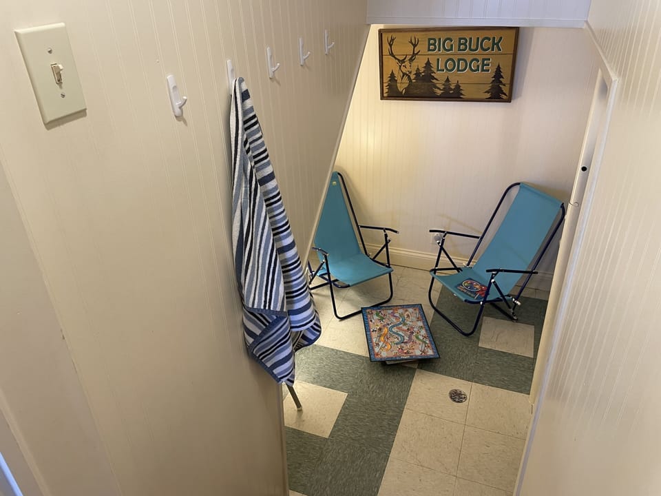 Under the stairs small nook is a fun hangout! Can also support your air mattress
