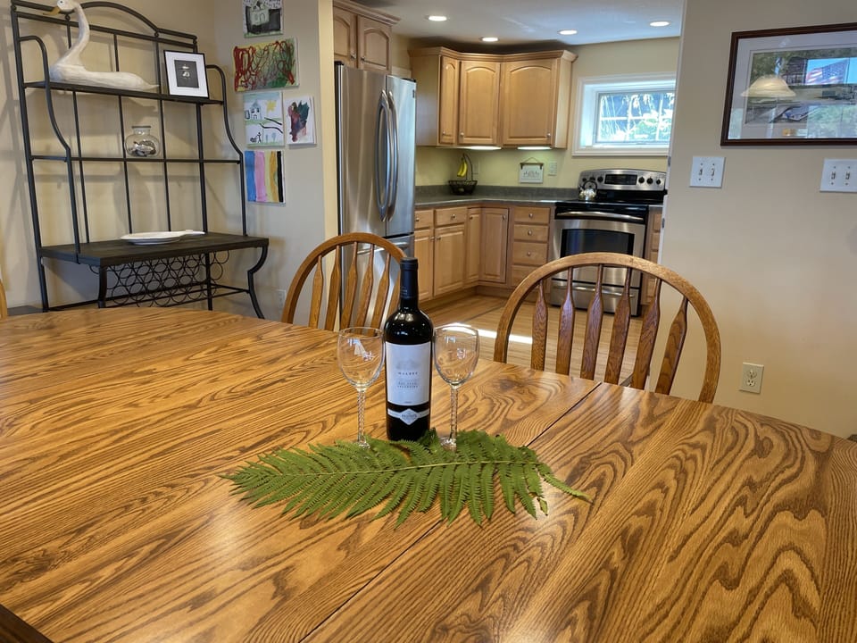 Large dining table. Highchair available.